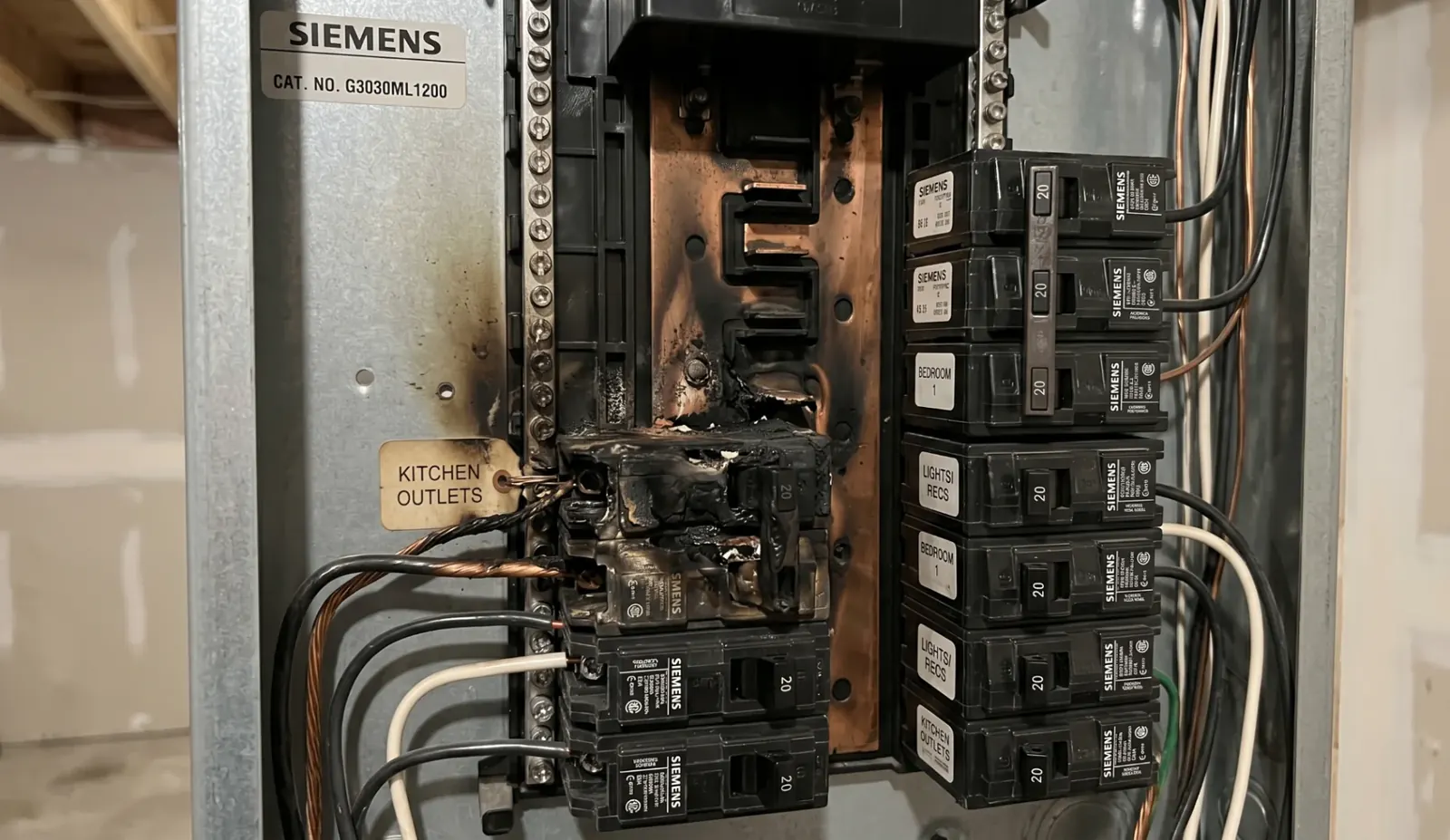 Burnt circuit breaker inside an electrical panel